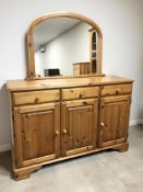 A reproduction pine three drawer sideboard, 132 cm x 45 cm x 87 cm,