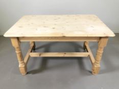 A reproduction pine farmhouse dining table, 133 cm x 79 cm x 76 cm,