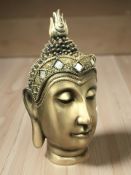 A resin bust of Buddha, height 29 cm.