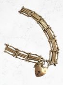 A 9ct yellow gold bracelet with heart clasp CONDITION REPORT: Bracelet broken. 17.4g.