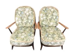 A pair of Ercol stained elm spindle back lounge armchairs, width 71 cm,