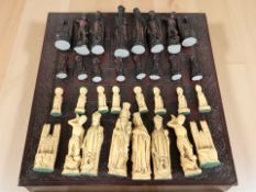 A decorative chess board and a set of resin chess pieces,