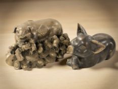 Two Chinese patinated figures of pigs, largest 18 cm wide.