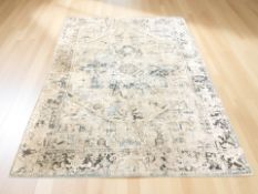 A machined eastern style carpet, 237 cm x 167 cm.