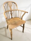 A 20th century elm spindle back Windsor chair, width 59 cm.