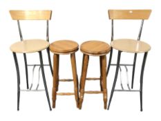 A pair of contemporary high chairs and a pair of pine stools.