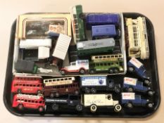A collection of die cast delivery vans, buses and trams including Corgi, etc.
