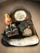 An Art Deco Bentima oak mantel clock, a polished horn, gas mask, a Russian doll,