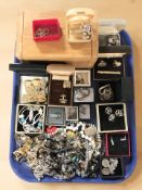 A collection of costume jewellery, silver earrings and chains, bead necklaces, simulated pearls,