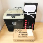 A Fellowes paper shredder, a Virgin Media box and an electric shower in box.