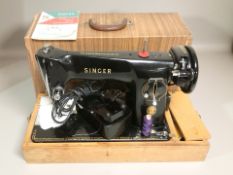A Singer 201K electric sewing machine with lead, pedal and manual.