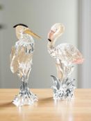 A Swarovski crystal heron and a flamingo, height 15 cm.