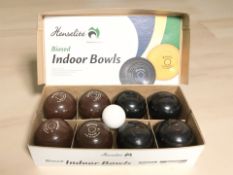 A box of Henselite biased indoor bowls.