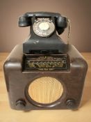 A Bush Bakelite valve radio, width 31 cm, together with a bakelite GPO telephone.
