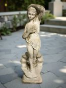 A weathered concrete garden figure of a scantily glad lady, height 111 cm.