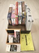 A group of board games, poker chip set,