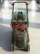 A Bosch electric lawnmower.