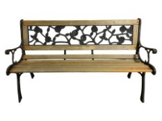A metal framed garden bench, width 128 cm.