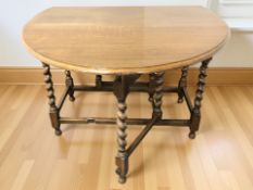 An oak barley twist gateleg drop leaf table.