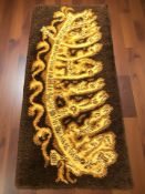 A 1970's shaggy piled rug, 150 cm x 70 cm.