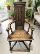 A Victorian carved oak high backed armchair in the renaissance style, width 64 cm.