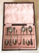 A cased set of six silver teaspoons and sugar tongs, Birmingham marks.