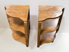 A pair of Art Deco style walnut veneered serpentine front corner shelves, height 49 cm.