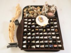 A group of Wade whimsies, a wooden thimble stand containing porcelain thimbles,