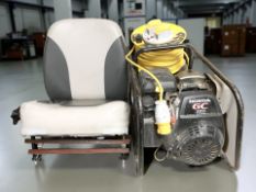A Honda GC160 generator, an extension reel and a seat.
