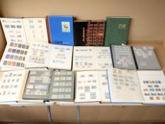 Twelve stamp albums and contents contained in a vintage suitcase.