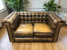 A contemporary Chesterfield two seater club settee,