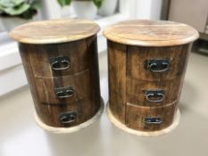 A pair of contemporary hardwood three drawer circular pedestal chests,