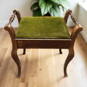 An Edwardian stained beech storage piano stool, width 56 cm.