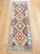 A Chobi Kilim runner, 148 cm x 51 cm.
