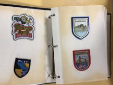 An album of embroidered blazer badges.