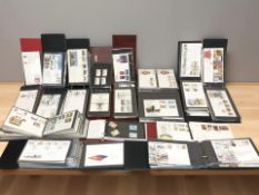 Twelve albums of first day covers.