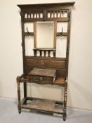 An Edwardian oak hall stand, width 101 cm.