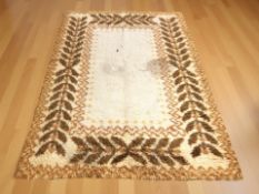 A 1970's shaggy piled rug, 243 cm x 172 cm.