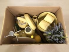 A group of enameled kitchen items including a kettle, storage jars, pot of artificial flowers,