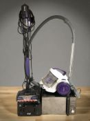 A Russell Hobbs microwave, a toaster and two vacuum cleaners.