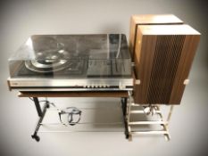 An ITT 2010 AM / FM stereo, and a pair of teak effect speakers on stands.