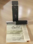 An Otis King calculator in box with instructions.