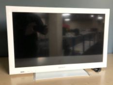 A Sony Bravia 26 inch LCD TV with lead
