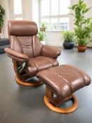 A Burgundy leather swivel lounge armchair and a matching footstool.