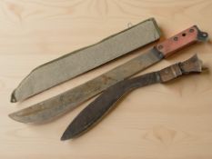 An antique kukri knife and a machete in canvas sheath.
