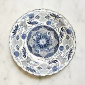 A Japanese Arita ware blue and white glazed charger, diameter 42 cm, six character mark to base.