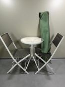 A glass topped patio table, diameter 52 cm,