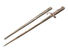 A French epee bayonet in metal scabbard.