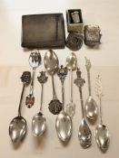 A group of silver comprising an Art Deco cigarette case with engine turned decoration,