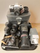 A Praktica MTL5 camera body, with Helios 44M lens, a Zenit EM camera body,